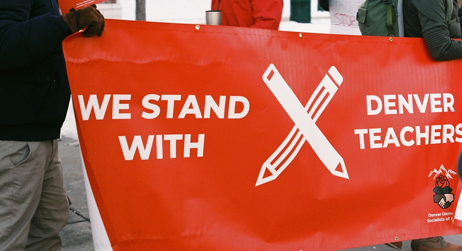 Denver DSA banner that reads 'We stand with Denver teachers'